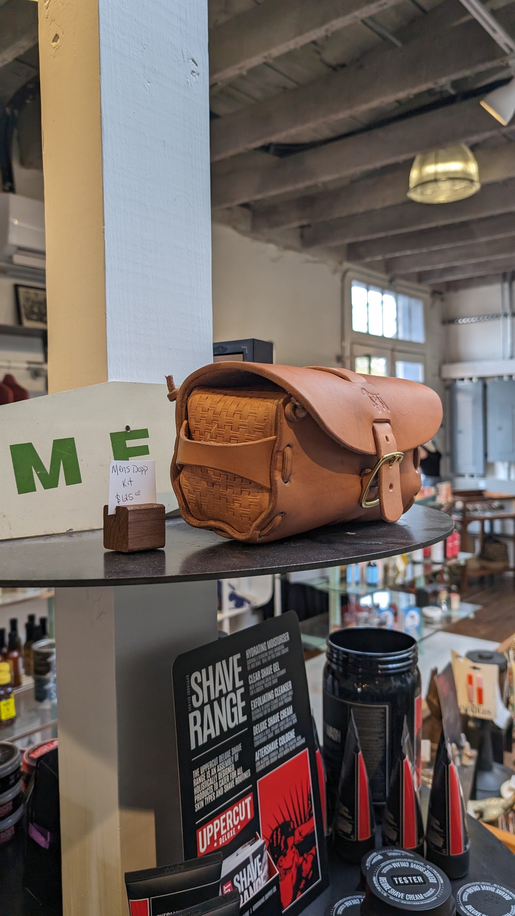 Brown Leather Dopp Kit On a Table By Ballad Of The Bird Dog