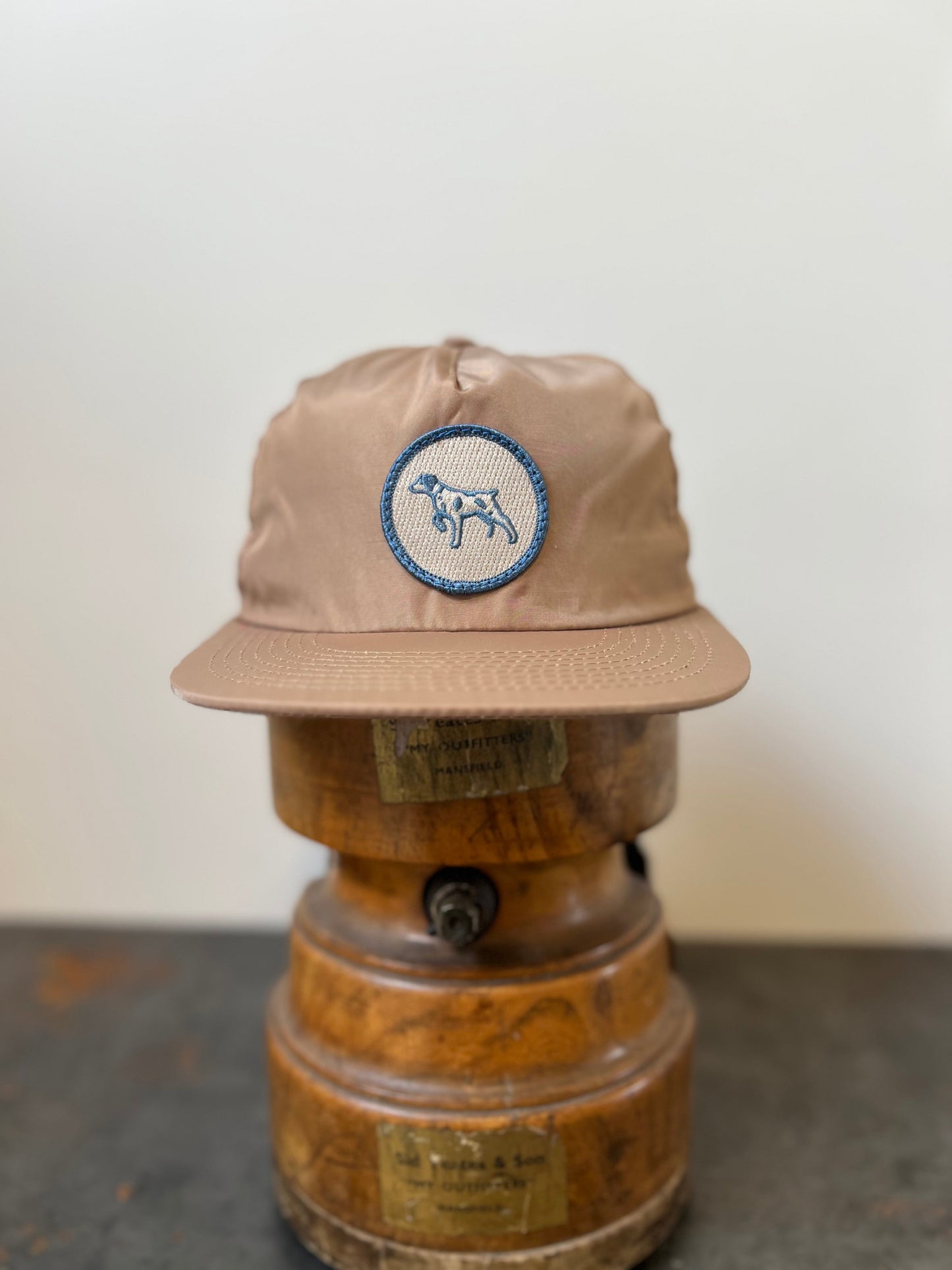 Shop Hat | Merit Badge | Ballad of the Bird Dog - Sand